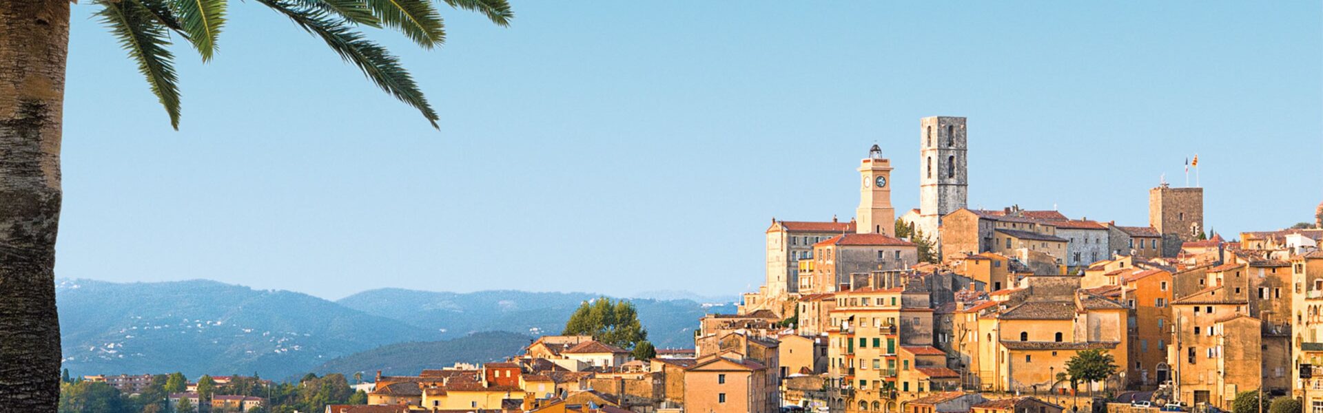 A tour guide in Grasse, France, explaining the history and significance of perfume production, with correct Grasse France pronunciation being key to a deeper understanding and appreciation of the town's heritage